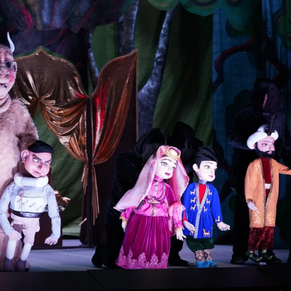 Puppets performing on stage during an enchanting show at the historic Baku Puppet Theatre in Azerbaijan.