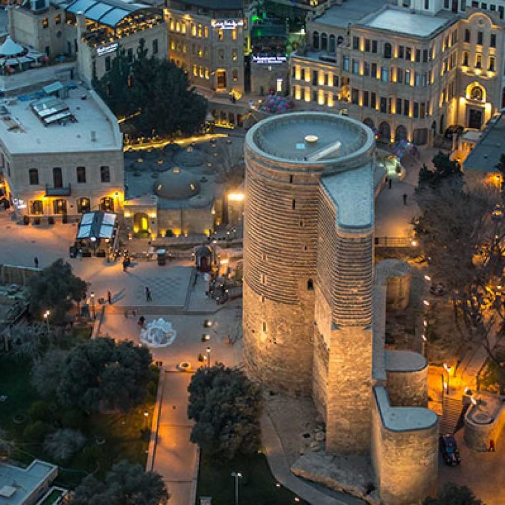 An upper-angle view of Icherisheher, Baku's Old City, showcasing the historic Maiden Tower and ancient architecture, a fantastic place for a family to explore.