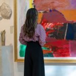 A girl viewing a portrait in The Museum of Modern Art in Baku